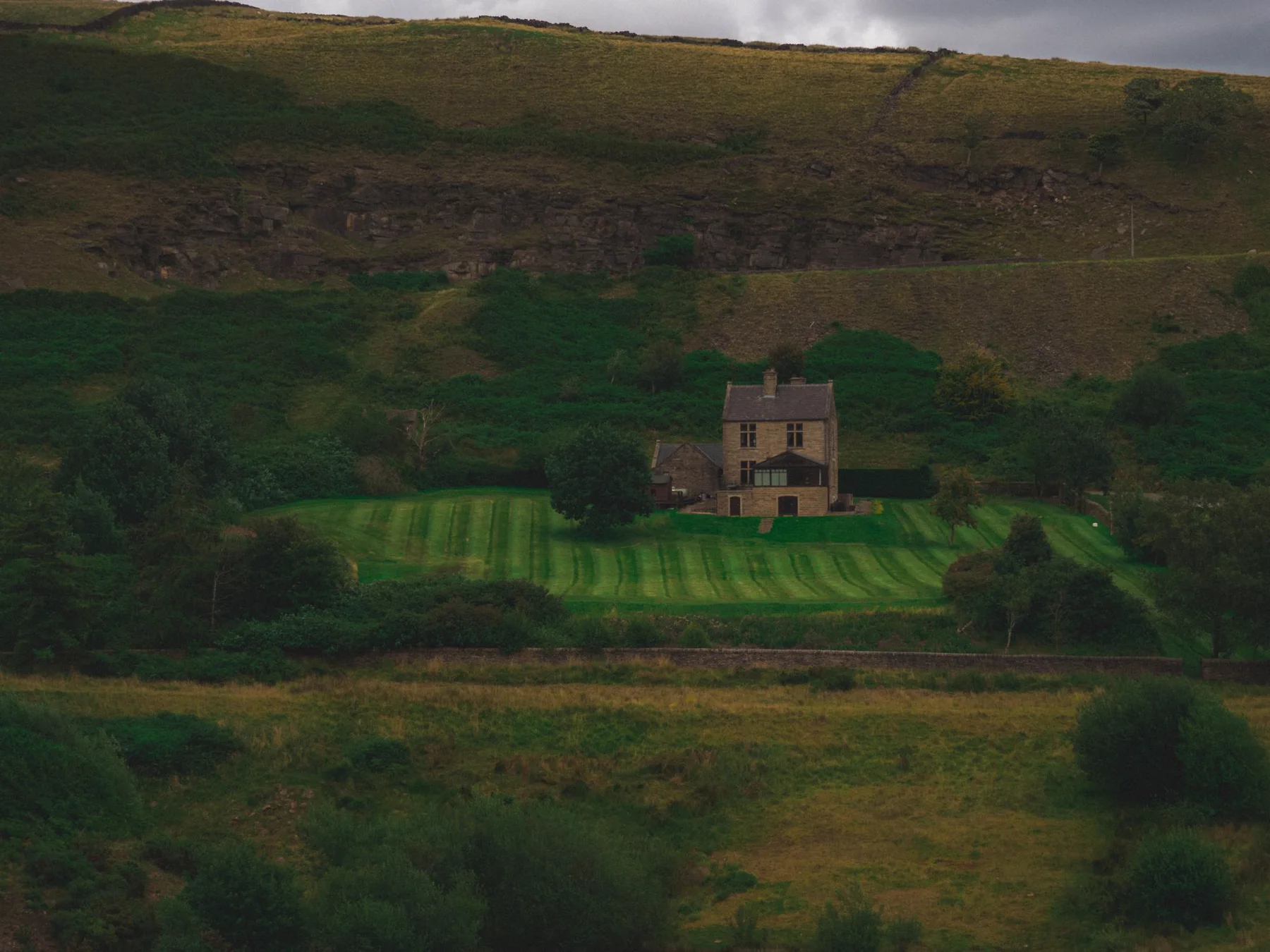 Stone country home in a green valley